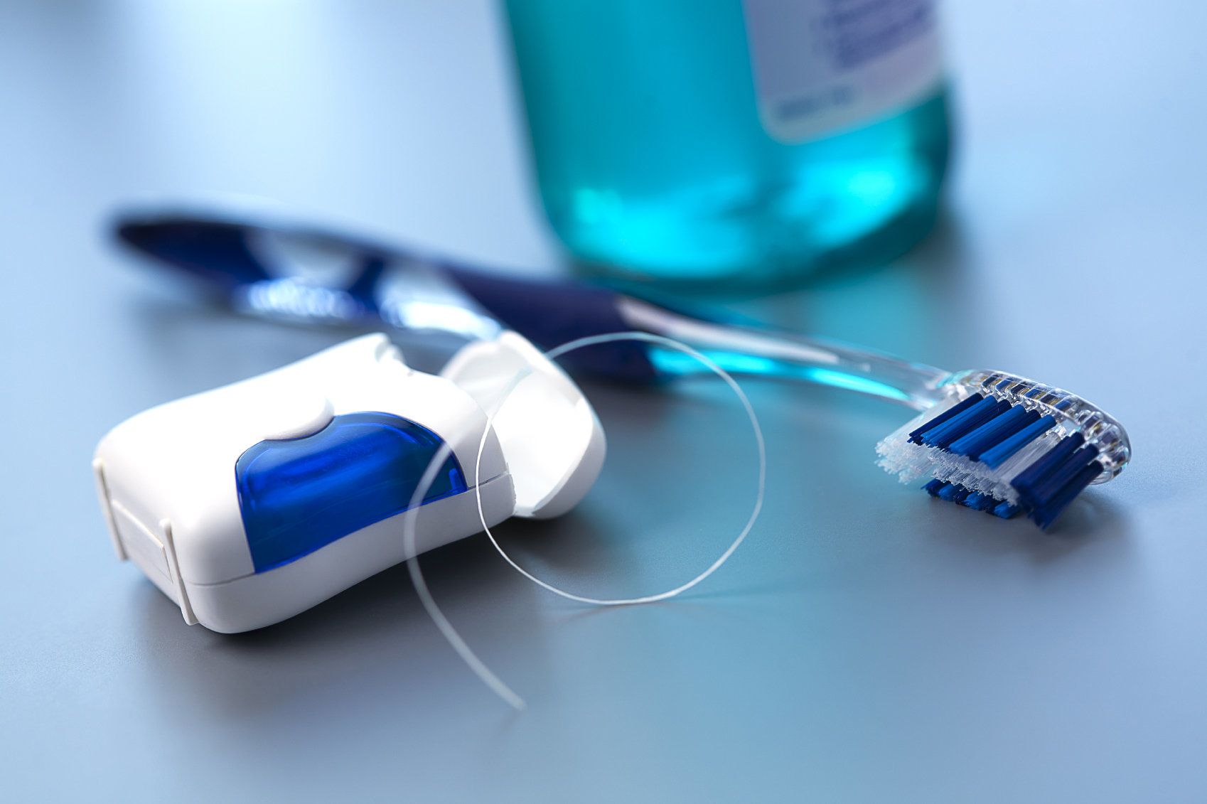 Floss and a toothbrush