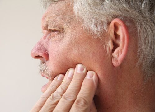 Man holding jaw