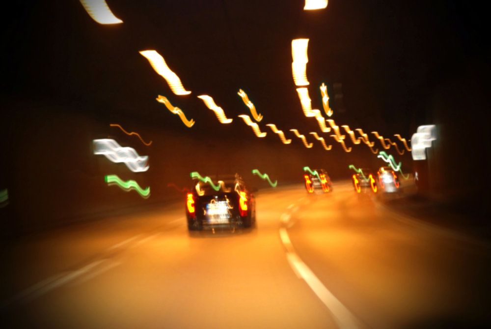 A blurry view of cars on the road