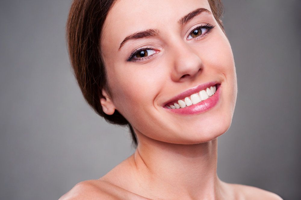 Woman smiling at the camera with perfect teeth