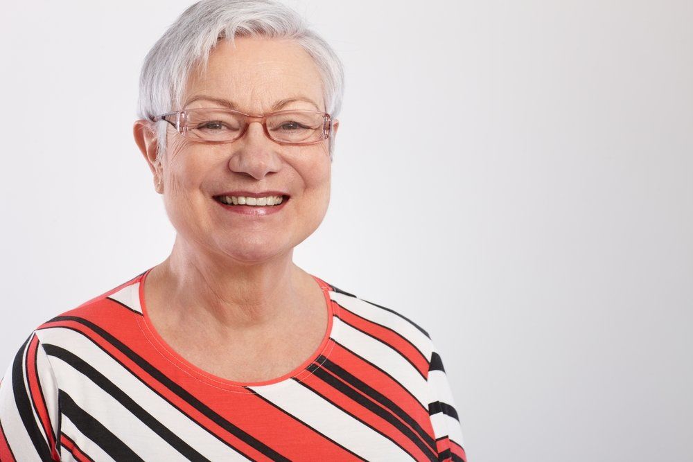 Senior woman wearing a pair of glasses