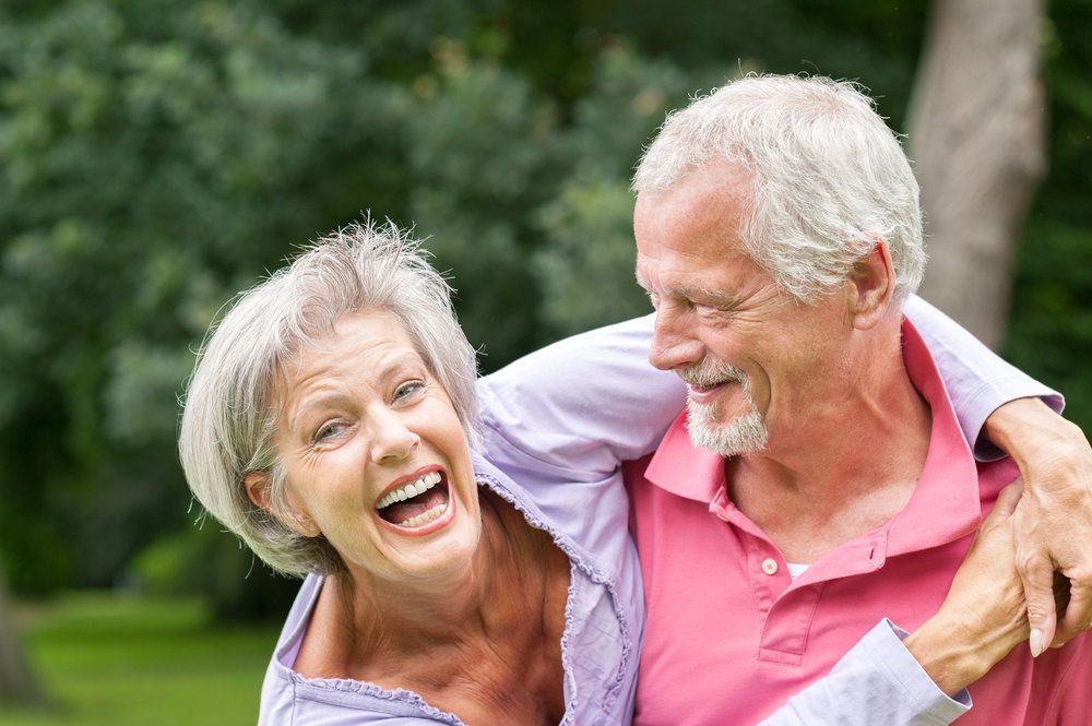 Laughing elderly couple