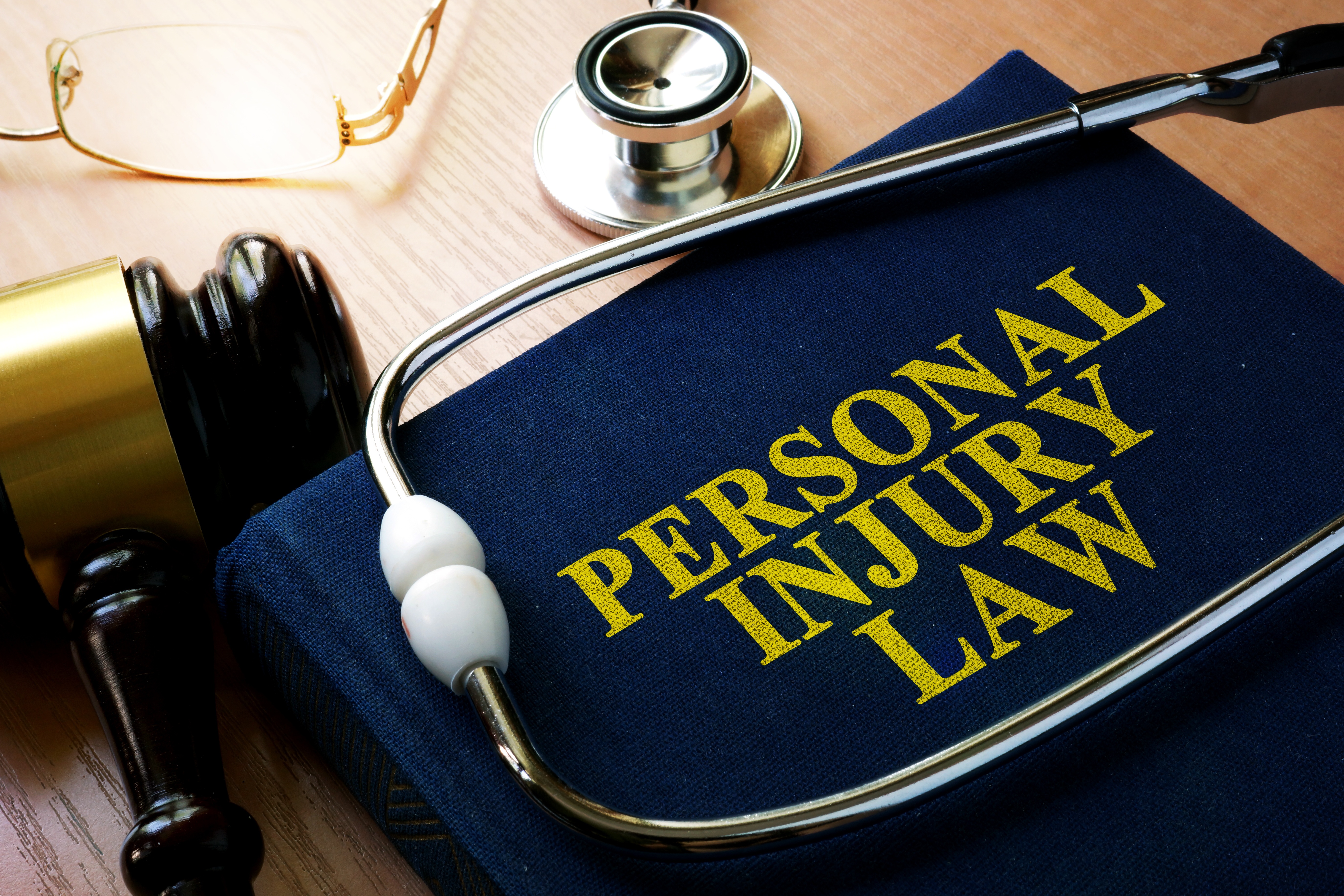stethoscope on top of a personal injury law book