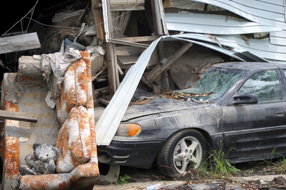 car crashed into the side of a house
