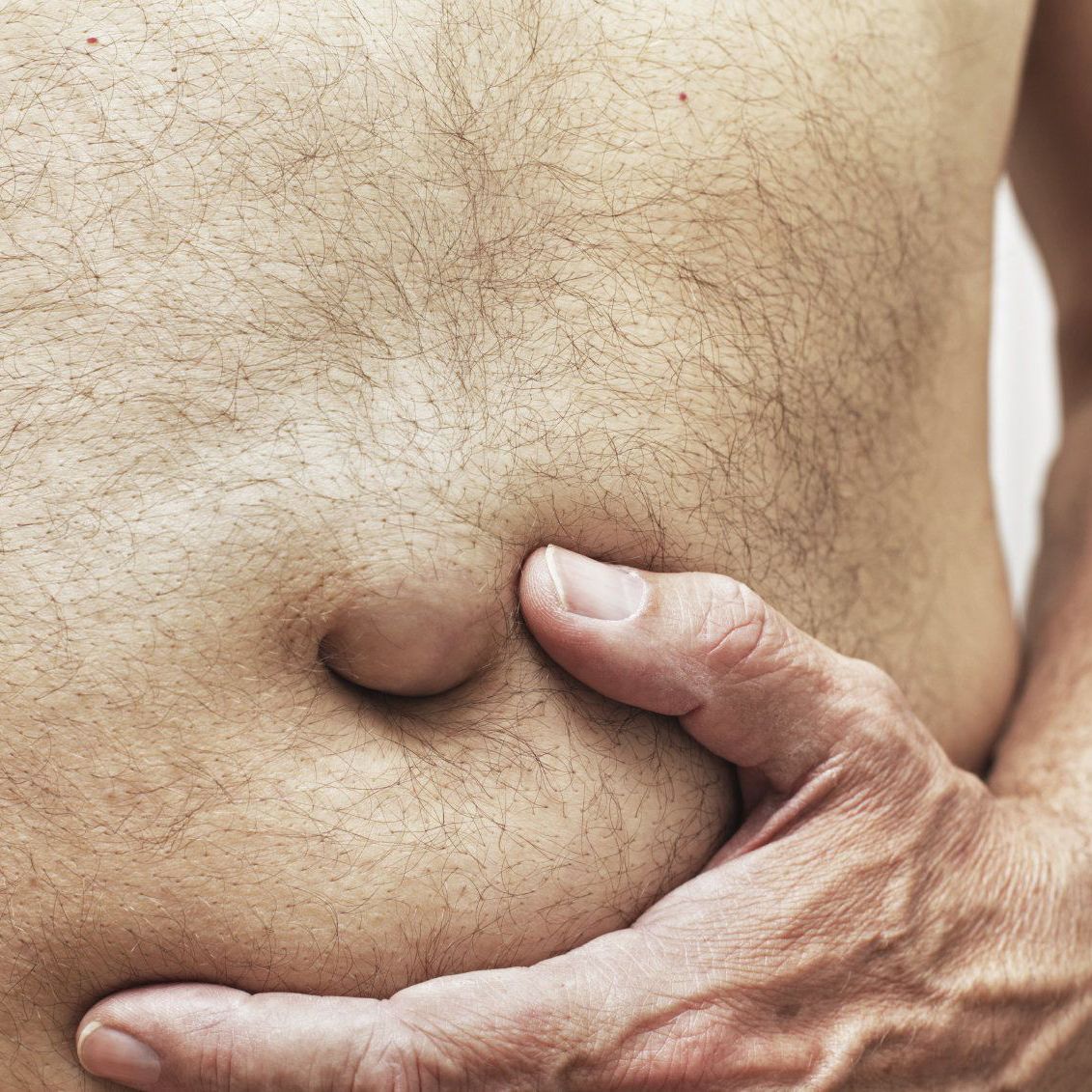 Close up of man's bellybutton