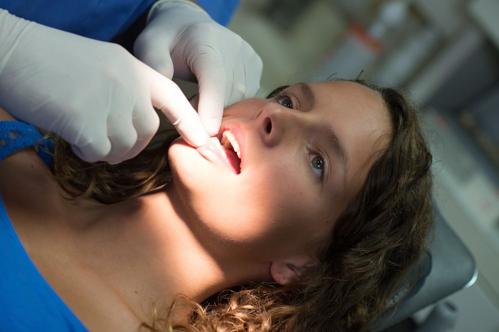 Photo of a woman undergoing a dental exam