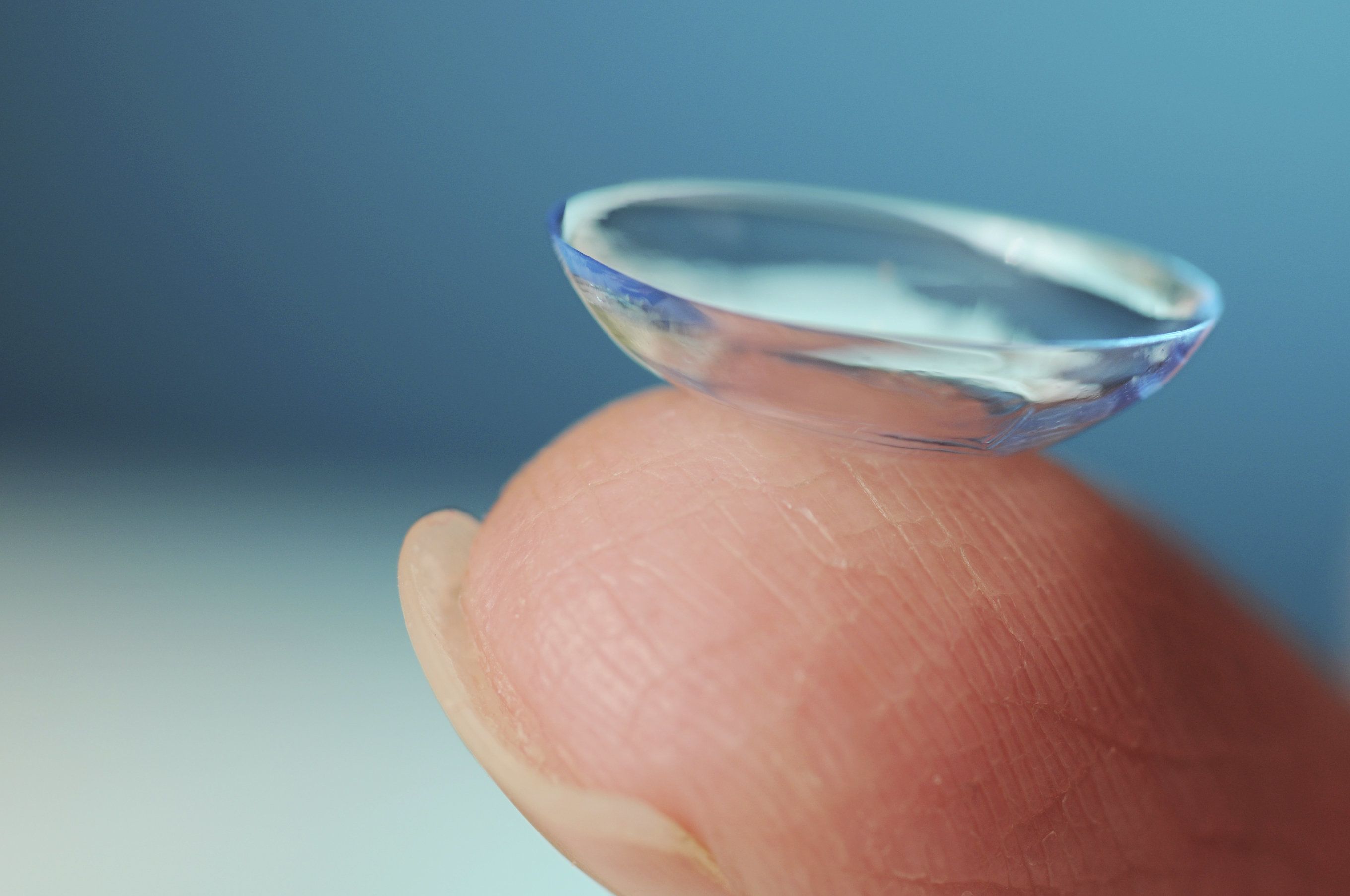 a contact lens on a finger
