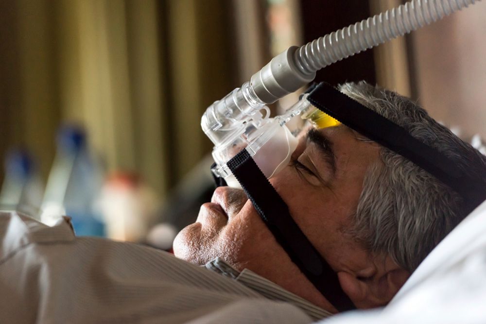 Patient wearing a CPAP device.
