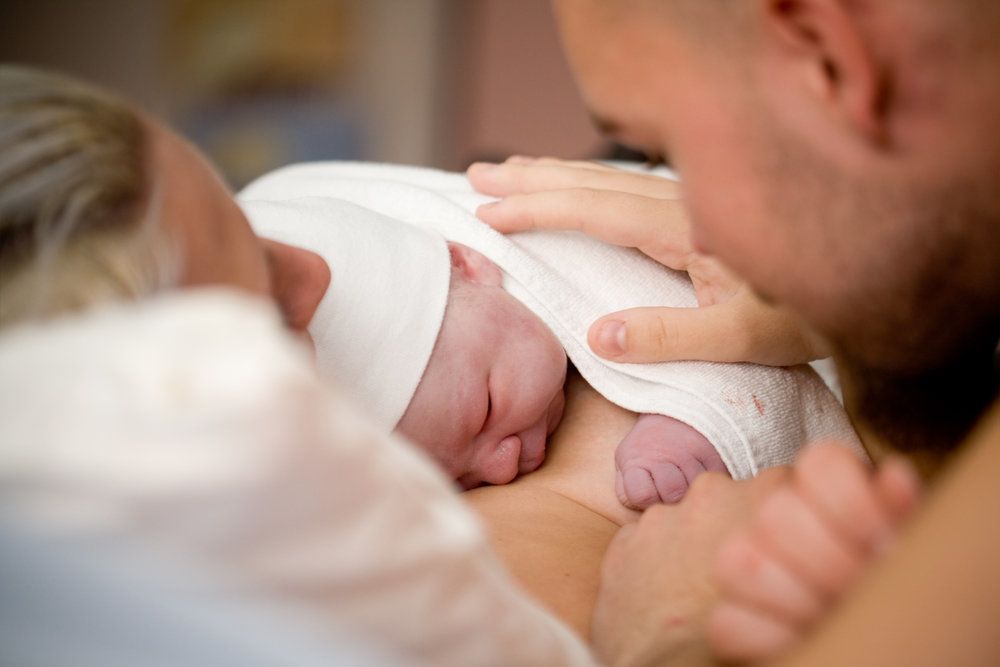 Photo of parents and a young child